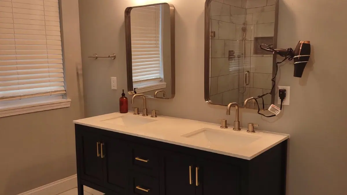 Double vanity with gold faucets, cleaned and dried