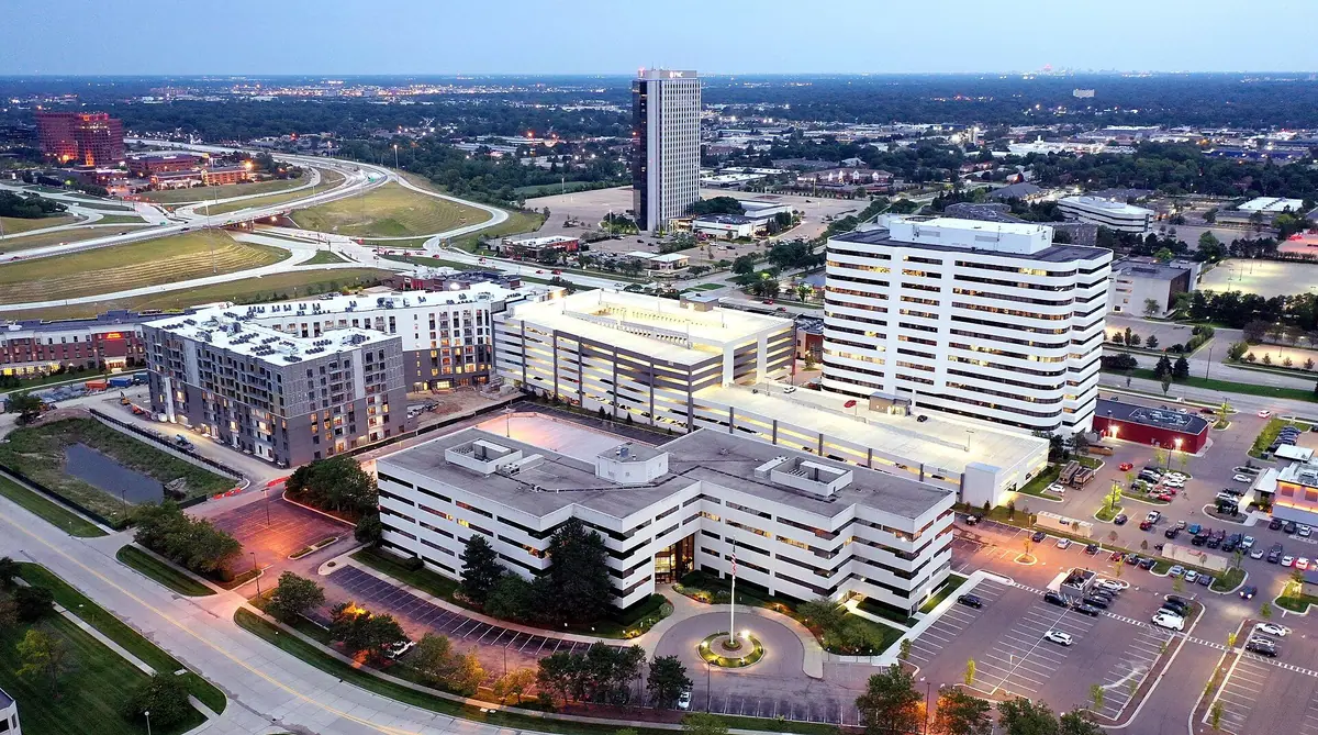 Dusk aerial view of the Big Beaver Road office corridor in Troy