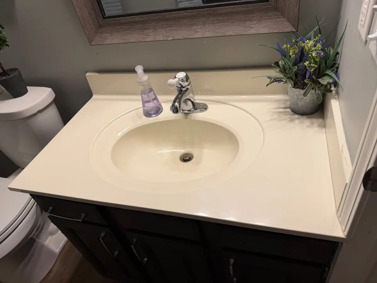 Bathroom vanity and sink wiped down and shining